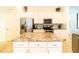 Updated kitchen featuring granite countertops and ample cabinet space at 4027 Oakrise Loop, Davenport, FL 33837