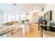 Modern kitchen with granite countertops and stainless steel appliances at 4027 Oakrise Loop, Davenport, FL 33837