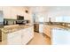 Spacious kitchen with granite countertops and stainless steel appliances at 4027 Oakrise Loop, Davenport, FL 33837