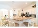 Eat-in kitchen boasts a large island with granite countertops at 4027 Oakrise Loop, Davenport, FL 33837