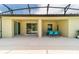 Spacious patio with table and chairs, adjacent to pool at 4027 Oakrise Loop, Davenport, FL 33837