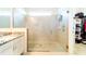 Large walk-in shower with glass enclosure and neutral tile at 4027 Oakrise Loop, Davenport, FL 33837