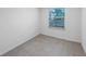 Empty room with window and tile floors at 4404 Desert Rose Ave, Kissimmee, FL 34746