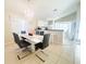 Elegant dining room featuring a large table, chandelier, and seating for six at 478 Tivoli Cir, Davenport, FL 33837