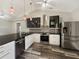 Modern kitchen with stainless steel appliances and granite countertops at 5933 Bible Camp Rd, Groveland, FL 34736