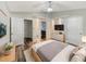 Spacious primary bedroom with ensuite bathroom and walk-in closet at 5933 Bible Camp Rd, Groveland, FL 34736