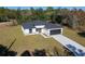 New construction home with a one-car garage, driveway, and grassy yard at 6215 148Th Southwest, Ocala, FL 34473