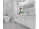 Modern bathroom with double vanity, white cabinets, and a soaking tub at 6215 148Th Southwest, Ocala, FL 34473