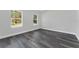 Bright bedroom with neutral walls and wood-look floors at 6215 148Th Southwest, Ocala, FL 34473