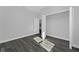 Spacious bedroom featuring wood-look floors and a large closet at 6215 148Th Southwest, Ocala, FL 34473