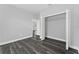Bright bedroom with gray vinyl flooring and a closet at 6215 148Th Southwest, Ocala, FL 34473