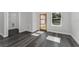 Bright laundry room with wood-look floors and closet at 6215 148Th Southwest, Ocala, FL 34473