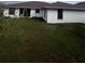 Large backyard with grassy area at 761 Americana Ct, Kissimmee, FL 34758