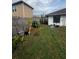 Backyard with fence, plants, and garden at 761 Americana Ct, Kissimmee, FL 34758