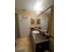 Elegant bathroom with dark brown vanity and large mirror at 761 Americana Ct, Kissimmee, FL 34758