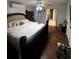 Spacious Primary bedroom with large bed and hardwood floors at 761 Americana Ct, Kissimmee, FL 34758