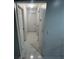 Clean hallway with white doors and marble-look tile flooring at 761 Americana Ct, Kissimmee, FL 34758