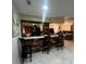 Kitchen with breakfast bar and stone accents at 761 Americana Ct, Kissimmee, FL 34758