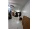 Open living area with a marble floor and a decorative wall at 761 Americana Ct, Kissimmee, FL 34758