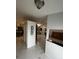 Open living area with marble flooring, and a decorative wall at 761 Americana Ct, Kissimmee, FL 34758