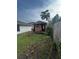 Small wooden storage shed in backyard at 761 Americana Ct, Kissimmee, FL 34758