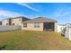 Large backyard with fenced in area at 1189 Cascade Dr, Davenport, FL 33837