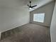 Bright and airy bedroom with ceiling fan and carpet at 1193 Sable Key Cir, Port Orange, FL 32128