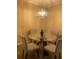 Simple dining area with glass table and four chairs at 1223 Arbor Lakes Cir, Sanford, FL 32771
