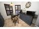 A breakfast nook with a glass table and dark blue cabinetry at 1236 N Fairway Dr, Apopka, FL 32712