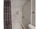 Bathroom with a walk-in shower and patterned shower curtain at 1440 Dann St, Orlando, FL 32804