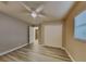 Bedroom with ceiling fan, large closet, and access to another room at 1440 Dann St, Orlando, FL 32804