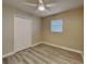 Bright bedroom with ceiling fan, window blinds, and wood-look floors at 1440 Dann St, Orlando, FL 32804