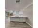 Updated kitchen boasting white cabinets and a large island at 1440 Dann St, Orlando, FL 32804