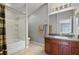 Clean bathroom with wood vanity, tub shower combo, and mirror at 1473 Broken Oak Dr # C, Winter Garden, FL 34787