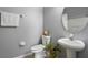 Updated bathroom with pedestal sink and oval mirror at 1473 Broken Oak Dr # C, Winter Garden, FL 34787