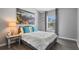 Cozy bedroom with gray walls and wood-look flooring at 1473 Broken Oak Dr # C, Winter Garden, FL 34787