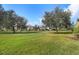 Community green space with large trees, walking path and homes at 1473 Broken Oak Dr # C, Winter Garden, FL 34787