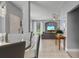 Open concept dining area with glass table and view of living room at 1473 Broken Oak Dr # C, Winter Garden, FL 34787