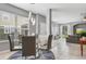 Elegant dining room with glass table, modern chairs, and a stylish chandelier at 1473 Broken Oak Dr # C, Winter Garden, FL 34787