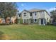 Two-story house with green exterior, landscaping, and grassy backyard at 1473 Broken Oak Dr # C, Winter Garden, FL 34787