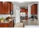 Updated kitchen, featuring stainless steel appliances and granite counters at 1473 Broken Oak Dr # C, Winter Garden, FL 34787