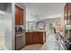 Open kitchen features breakfast bar and view to living room at 1473 Broken Oak Dr # C, Winter Garden, FL 34787