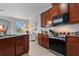 Spacious kitchen with stainless steel appliances and granite countertops at 1473 Broken Oak Dr # C, Winter Garden, FL 34787