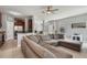 Living room with sectional sofa, kitchen view, and backyard access at 1473 Broken Oak Dr # C, Winter Garden, FL 34787