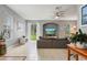 Open living space with grey sectional, TV, and backyard view at 1473 Broken Oak Dr # C, Winter Garden, FL 34787
