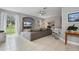 Living area with sectional sofa, large TV, and sliding glass doors at 1473 Broken Oak Dr # C, Winter Garden, FL 34787