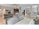 Open concept living room with kitchen and sectional sofa at 1473 Broken Oak Dr # C, Winter Garden, FL 34787