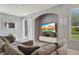 Spacious living room featuring a sectional sofa and a large flat-screen TV at 1473 Broken Oak Dr # C, Winter Garden, FL 34787