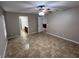 Bedroom with tile floors, ceiling fan and bathroom access at 15340 Perdido Dr, Orlando, FL 32828