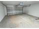 Spacious garage with automatic opener and ample space for parking and storage at 15340 Perdido Dr, Orlando, FL 32828